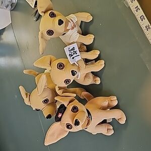 4 Tocco Bell dogs. Very good used condition Adorable little‎ guys.